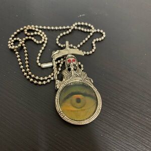 Grim reaper goth necklace. Evil eye pendant. Silvertone. Lightweight. Halloween